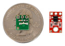 QTR-L-1RC reflectance sensor on a quarter next to a QTR-1A reflectance sensor.