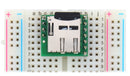Breakout Board for microSD Card plugged into a breadboard with microSD card (not included) inserted.