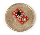 QTR-1A reflectance sensor on a quarter for size reference.